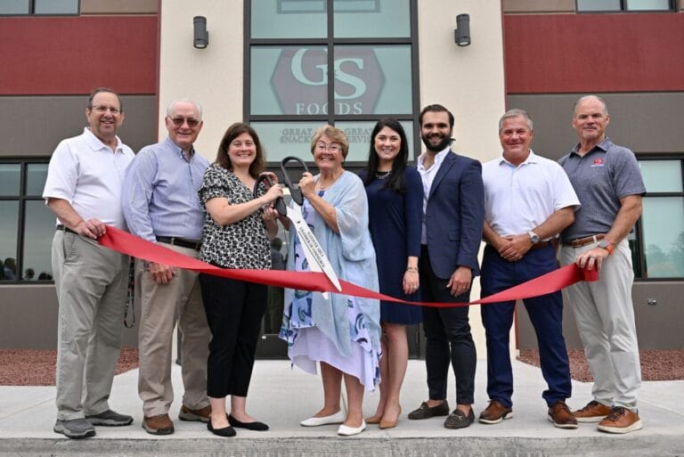 Group of G&S Foods workers cutting the ribbon at the new facility.