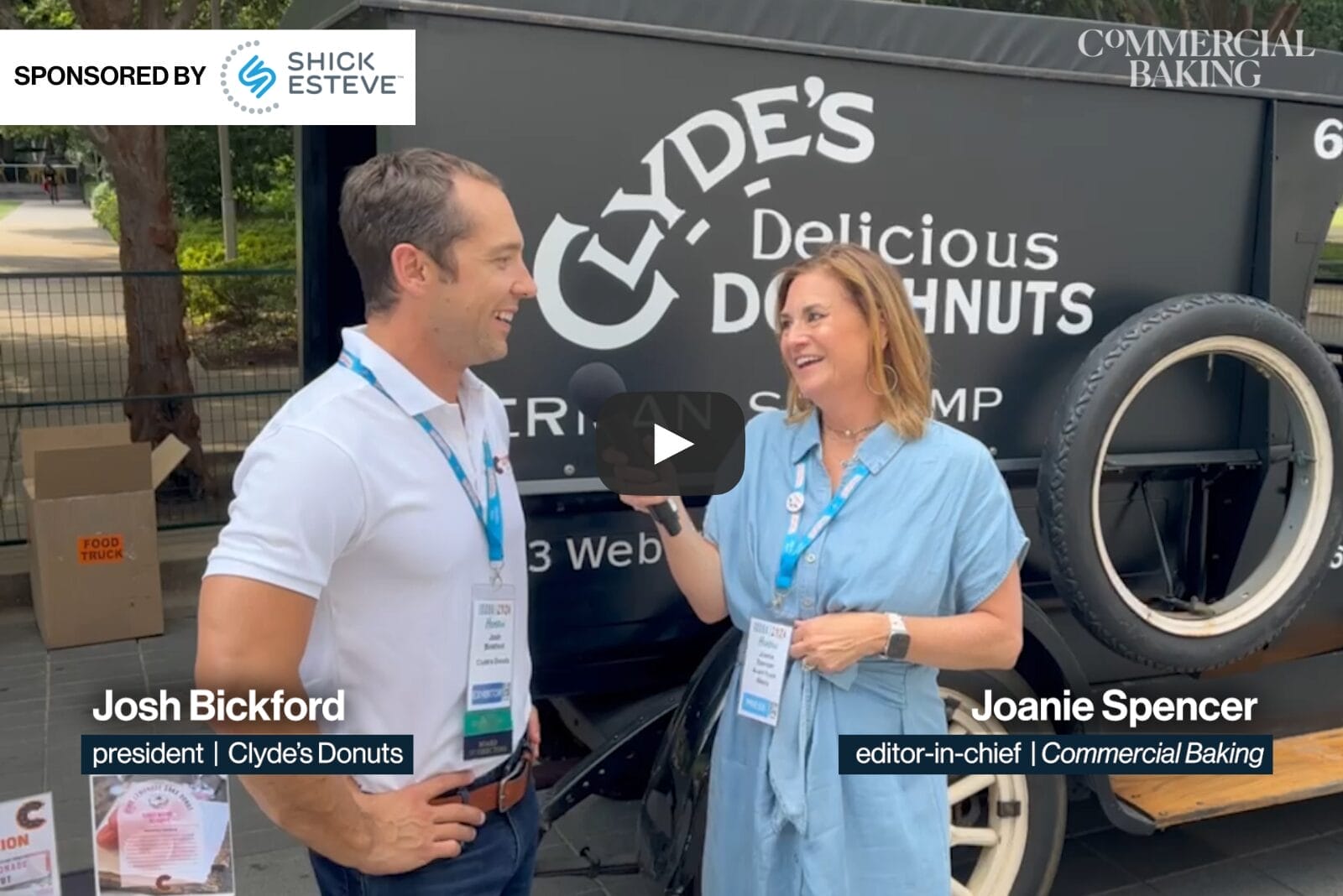 Still frame of two people talking in front of a vintage food truck about donut innovation.