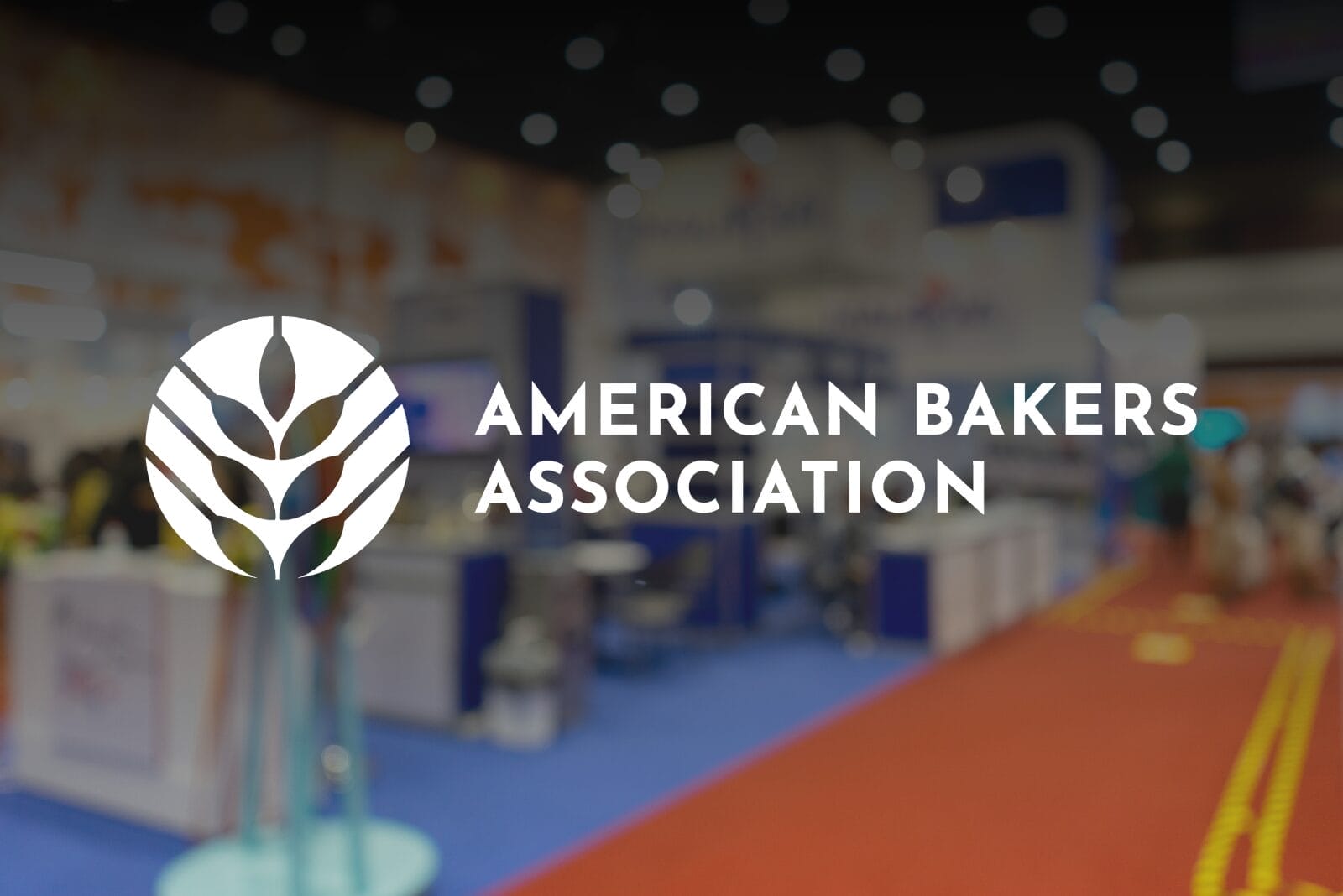 American Bakers Association logo on tradeshow floor background.