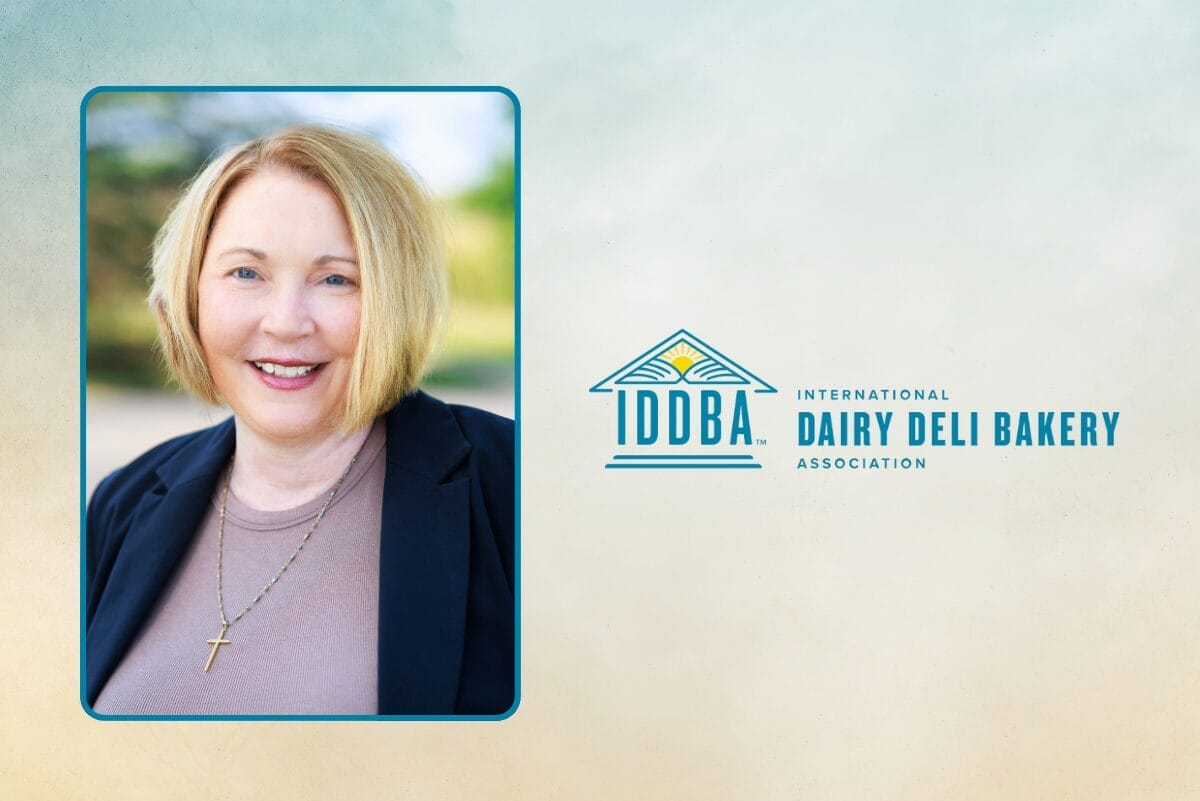 Headshot of Whitney Atkins on gradient blue background with IDDBA logo.