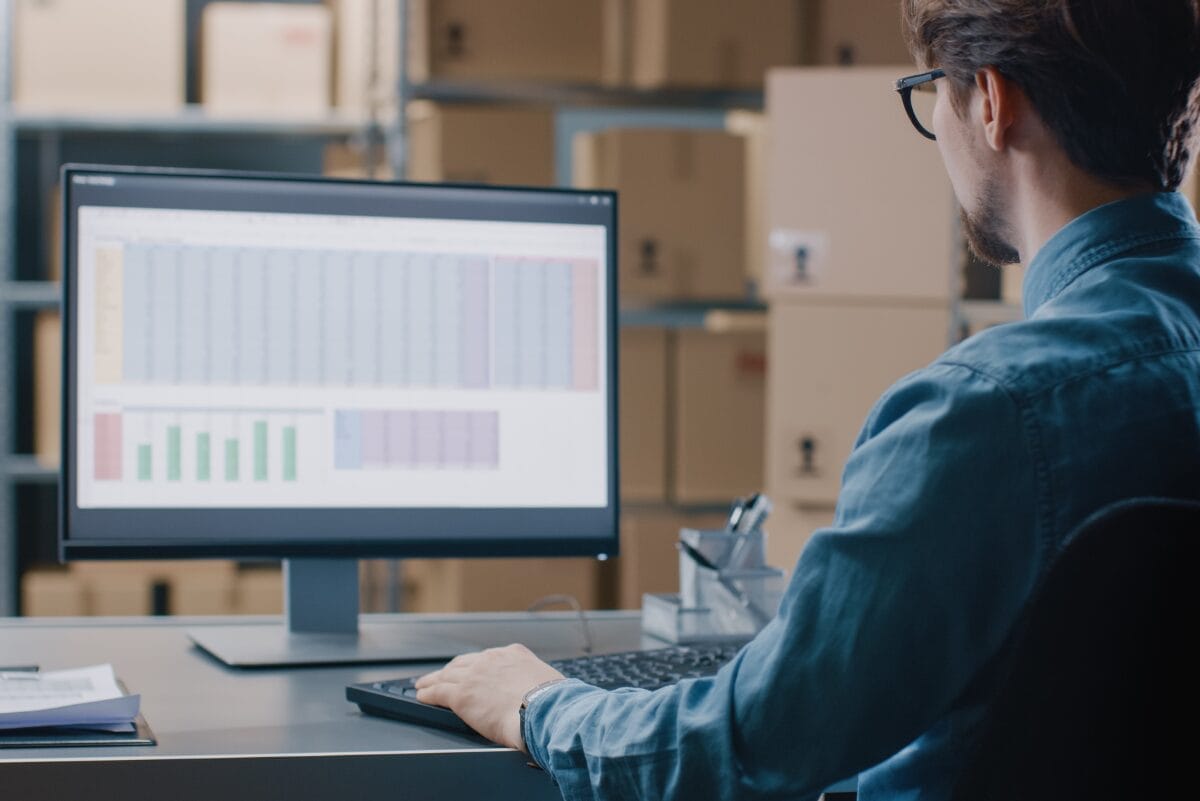 person sitting at a desk looking at a computer regulatory changes