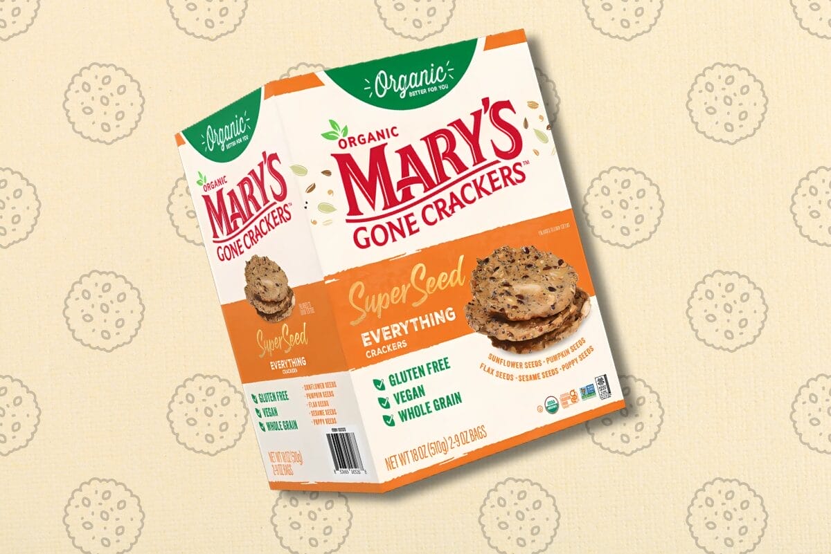 Package of Mary's Gone Crackers on gradient tan background with cracker graphics.