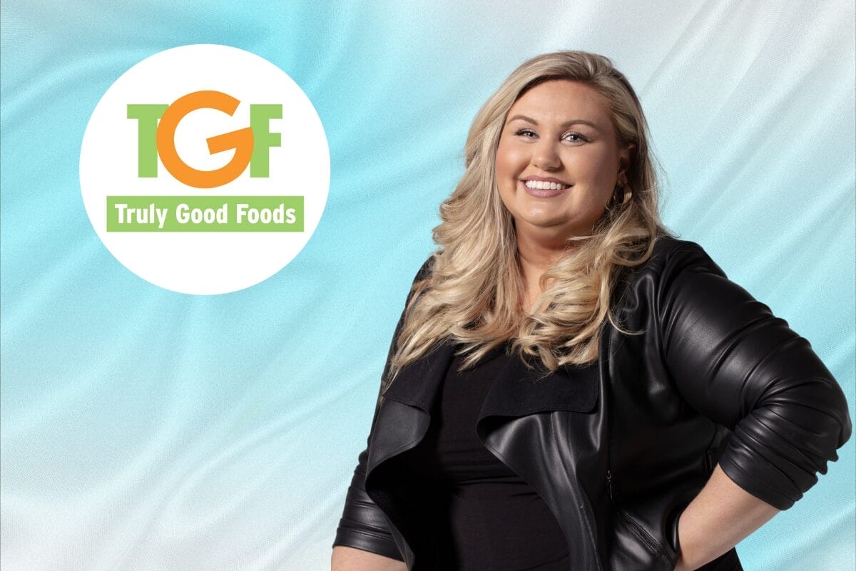 Headshot of Lisa Smith and Truly Good Foods logo on gradient blue background.