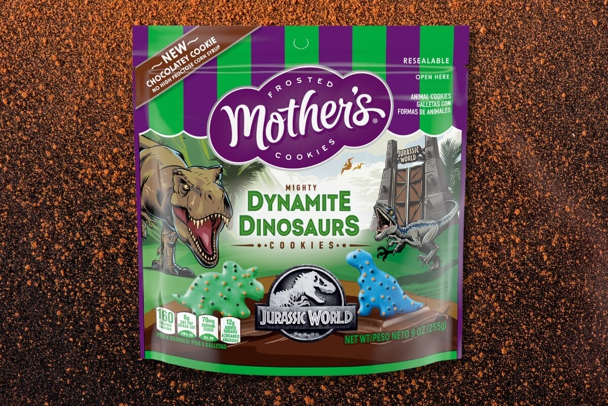 Mother's Cookies Dynamite Dinosaurs pouch over image of cocoa powder