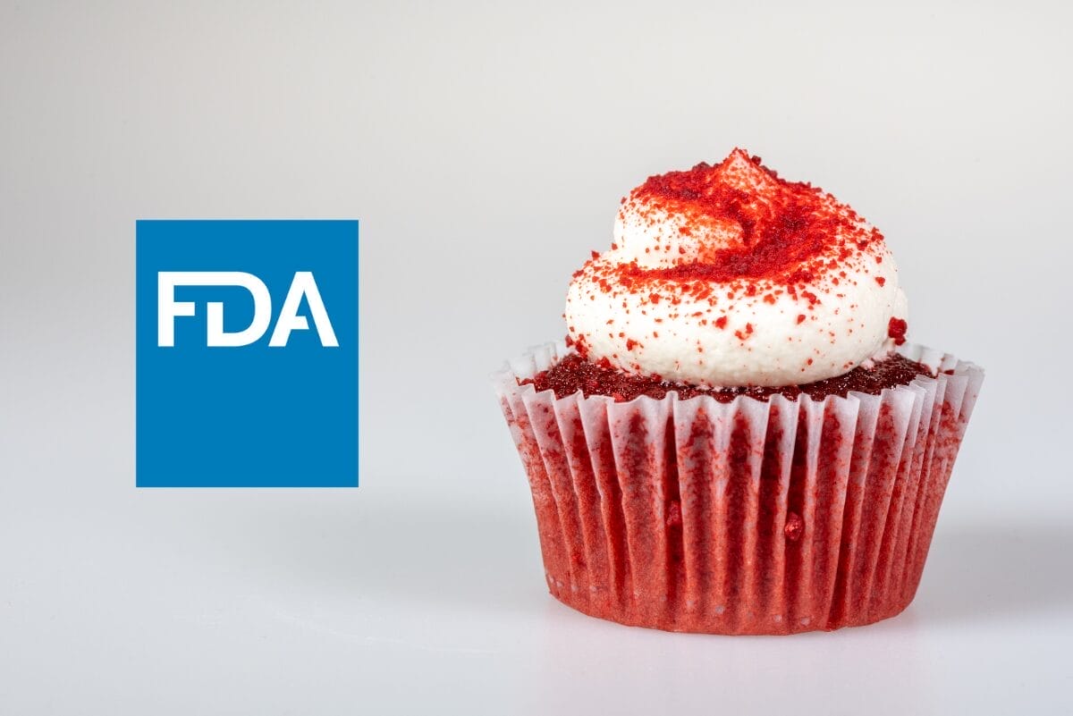 FDA logo next to red velvet cupcake with white frosting on light gray background