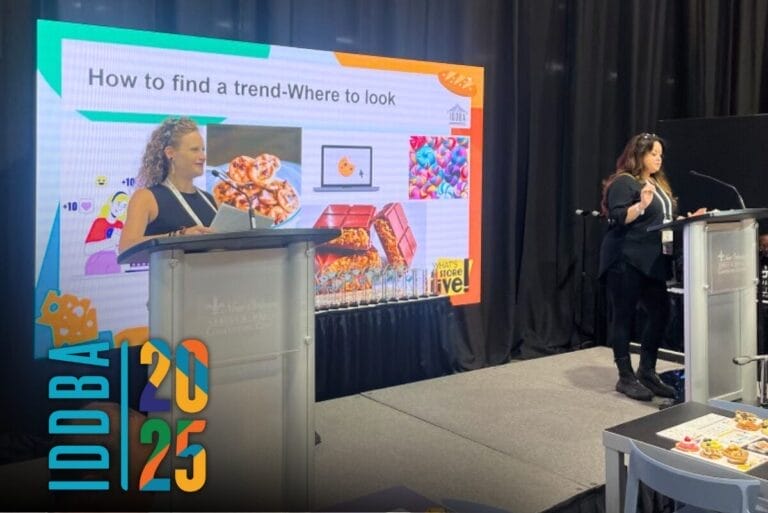 Katrina Robbins and Darcy Martin from David's Cookies presenting on cookie trends at IDDBA 2025