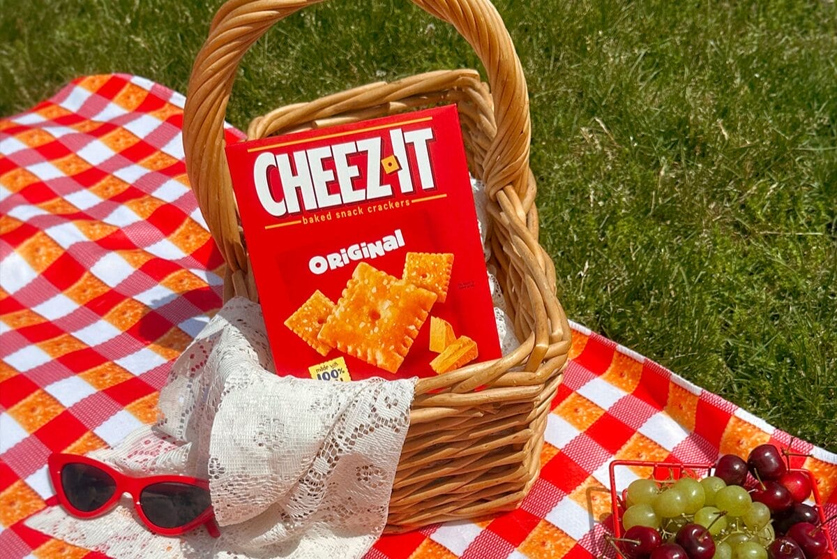 Cheez-It box in a basket on picnic blanket