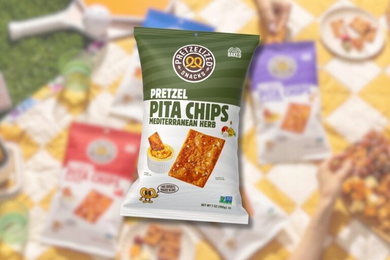 Pretzelized Mediterranean Herb Pretzel Pita Chips bag over picnic featuring other pretzel pita chips packages