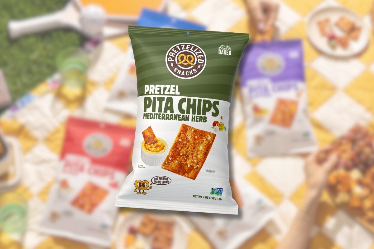 Pretzelized Mediterranean Herb Pretzel Pita Chips bag over picnic featuring other pretzel pita chips packages