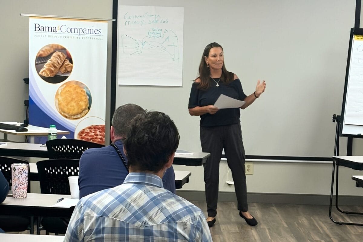 Paula Marshall, CEO of The Bama Cos., speaking in front of her team