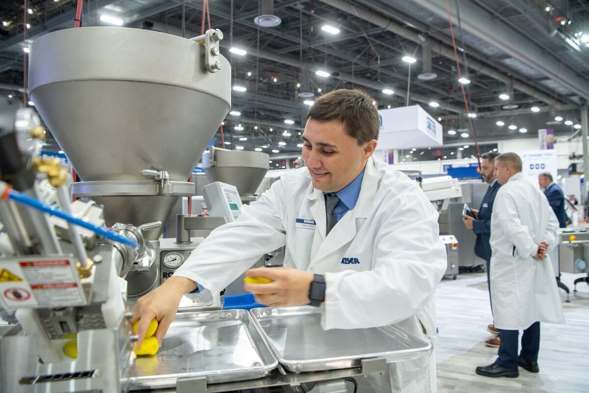Baking industry member demonstrating equipment at IBIE 2022