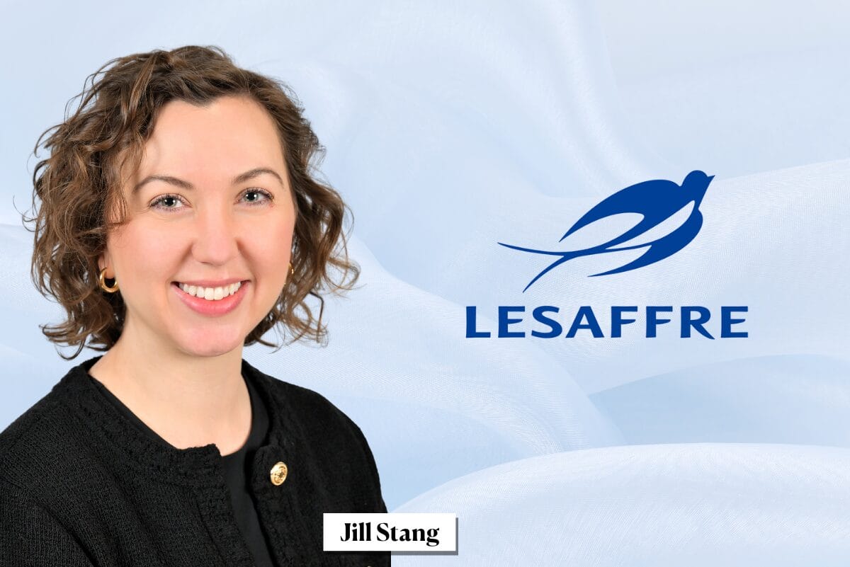 Jill Stang in black shirt to the left of blue Lesaffre logo