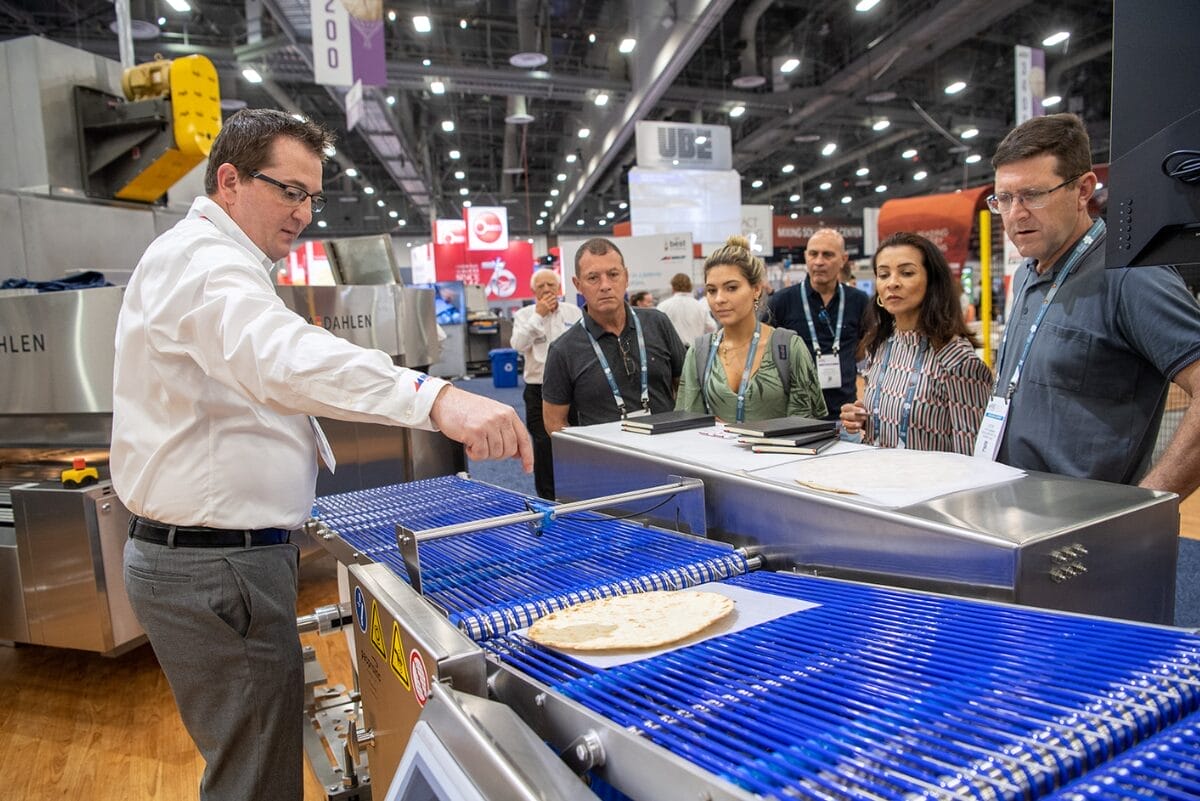 Middleby employee showcasing equipment at IBIE 2022