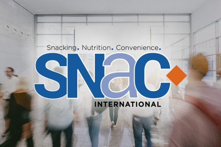 SNAC International logo on background of tradeshow attendees