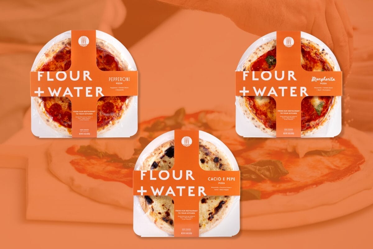 Flour + Water Foods frozen pizzas over orange background with pizza being made