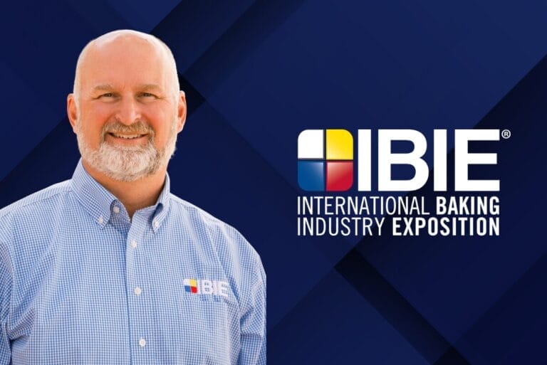 Allen Wright, IBIE 2025 vice chair, next to logo for IBIE over dark blue background
