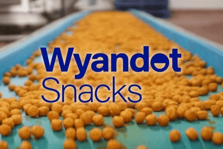 Wyandot Snacks logo over production line of cheese puffs